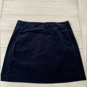 J. Crew black velvet Mini-skirt with pockets.